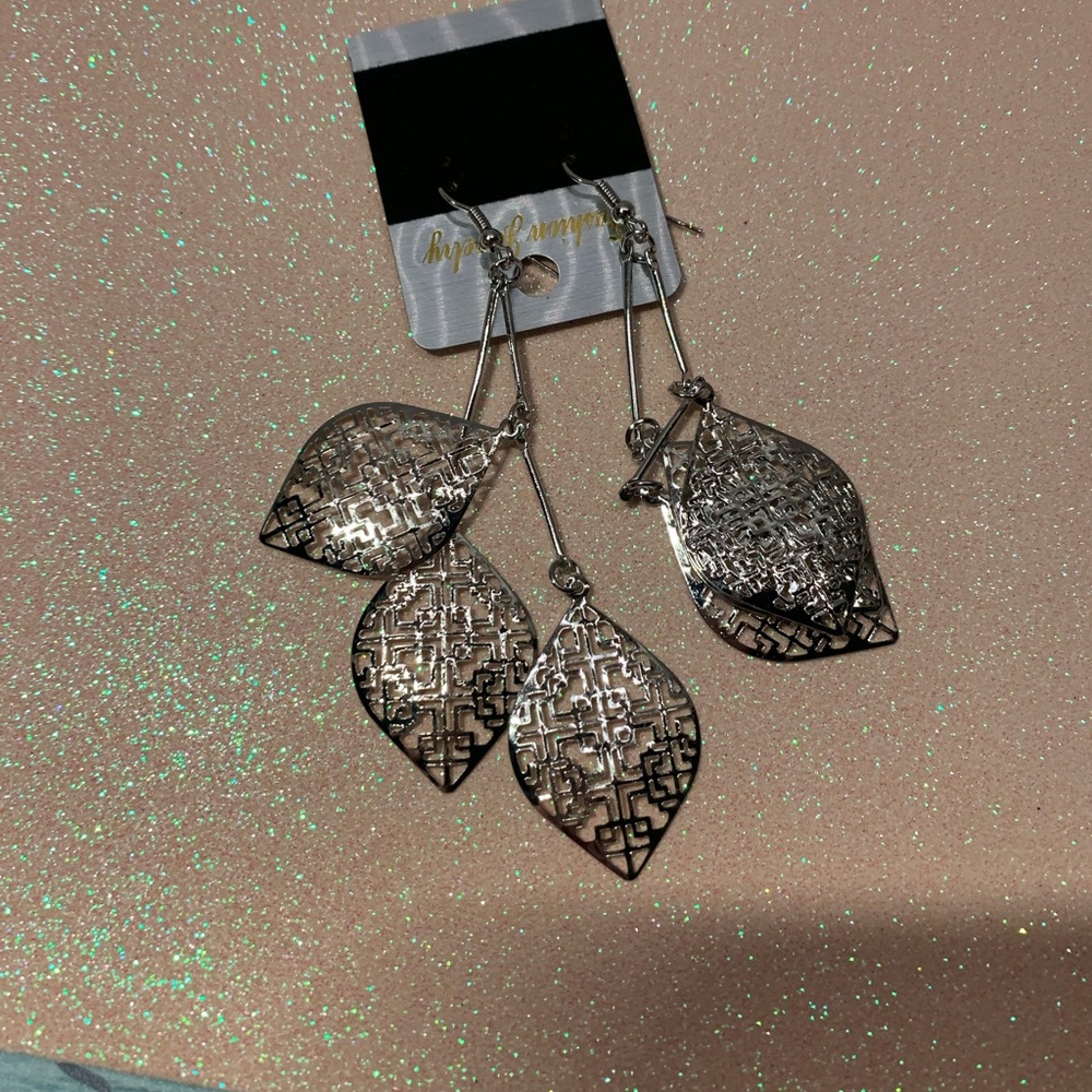 Dangling silver tone leafs